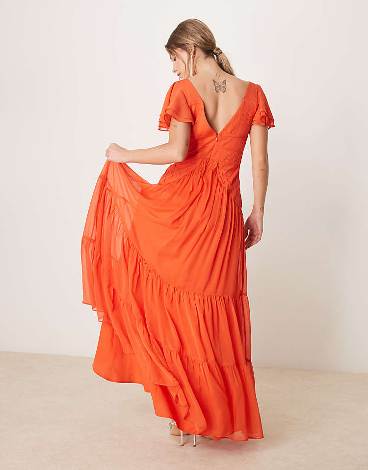 https://images.asos-media.com/products/asos-design-flutter-sleeve-ruched-maxi-dress-with-hi-low-hem-in-spicy-red/207527342-3?$n_750w$&wid=750&fit=constrain